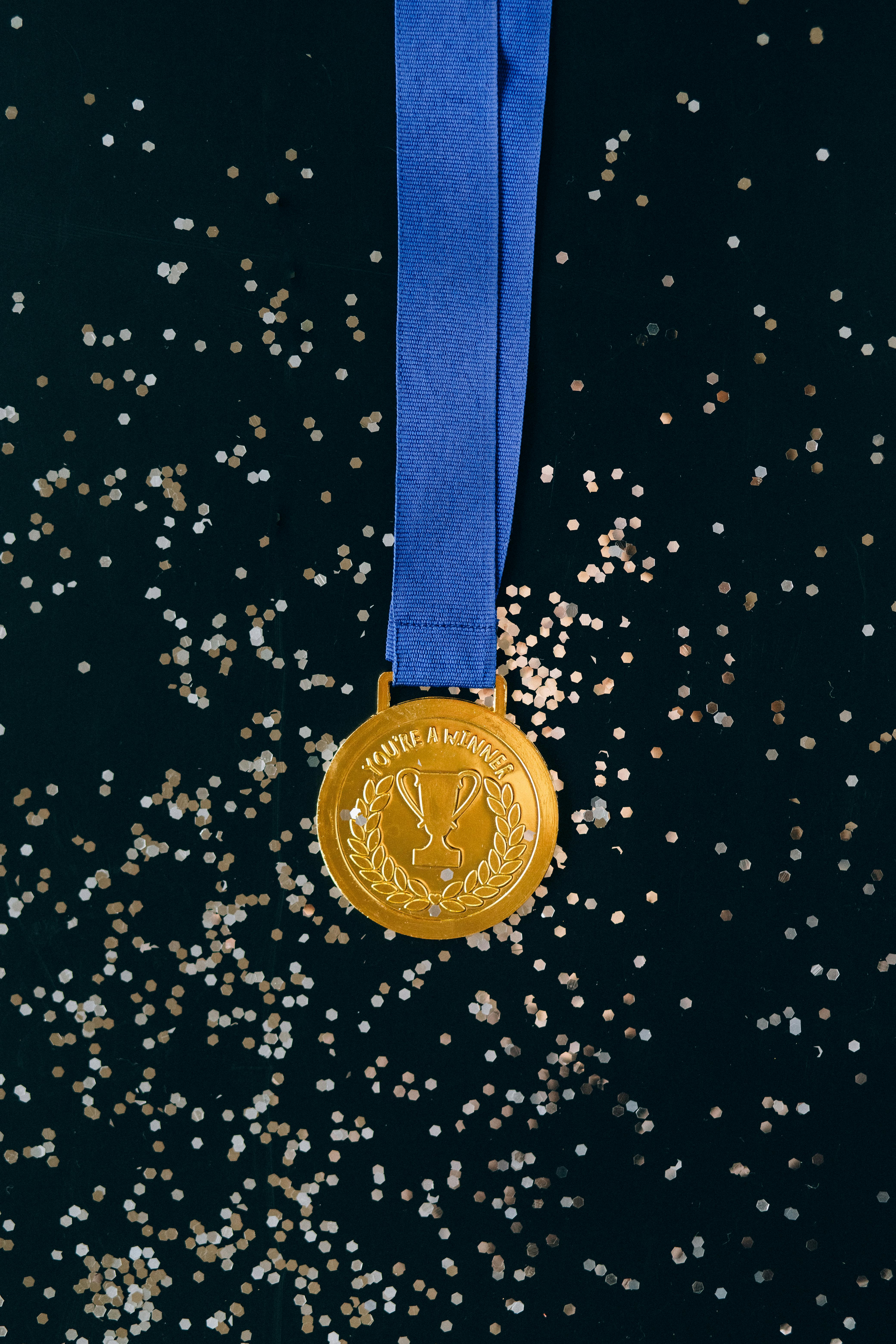 Student holding a medal at school sports event